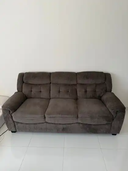 Grey three-seater sofa collected in Dubai
